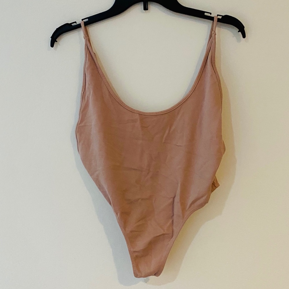 High leg Pink one piece top *never worn*